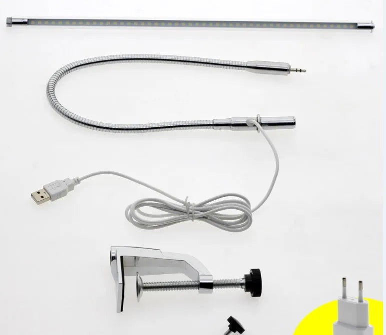 Silver LED clip-on table lamp with long adjustable arm for nail lighting and detailed work