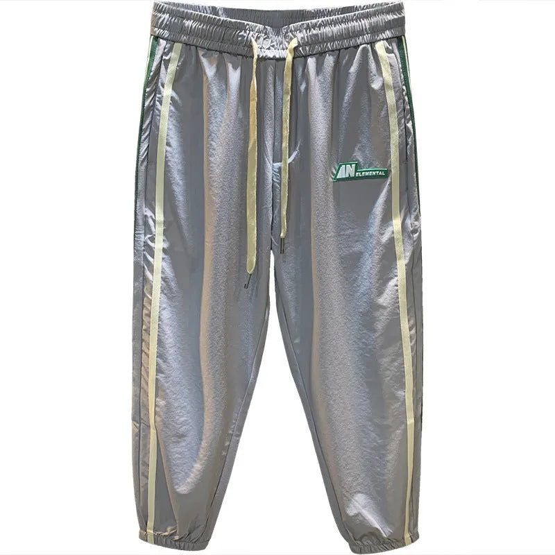 Men's black ice silk harem trousers with mid waist design and relaxed fit
