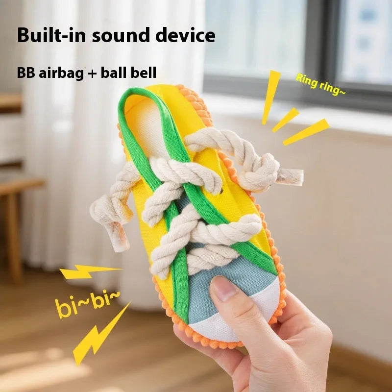 Slipper-shaped plastic dog chew toy with squeaker in three colour options