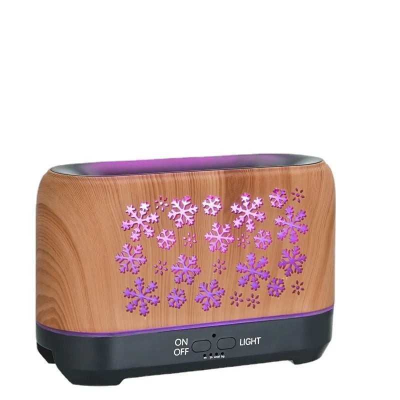 Wood grain snowflake pattern aromatherapy humidifier with colourful flame effect lighting on desktop