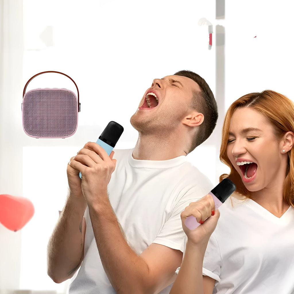 Small white portable Bluetooth speaker with built-in microphone on a table.