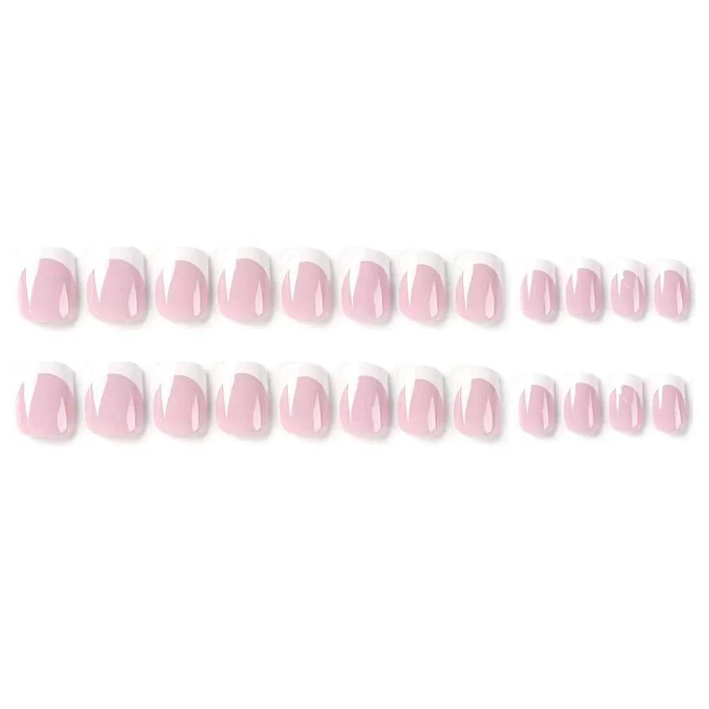 24 white false nail tips with a black and white plaid pattern, arranged on a card.