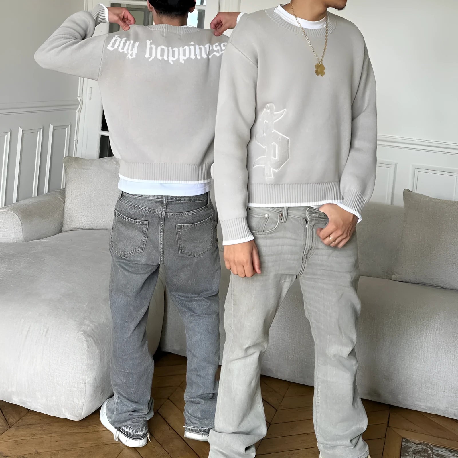 Grey loose-fitting jacquard knitwear coat with long sleeves on a hanger