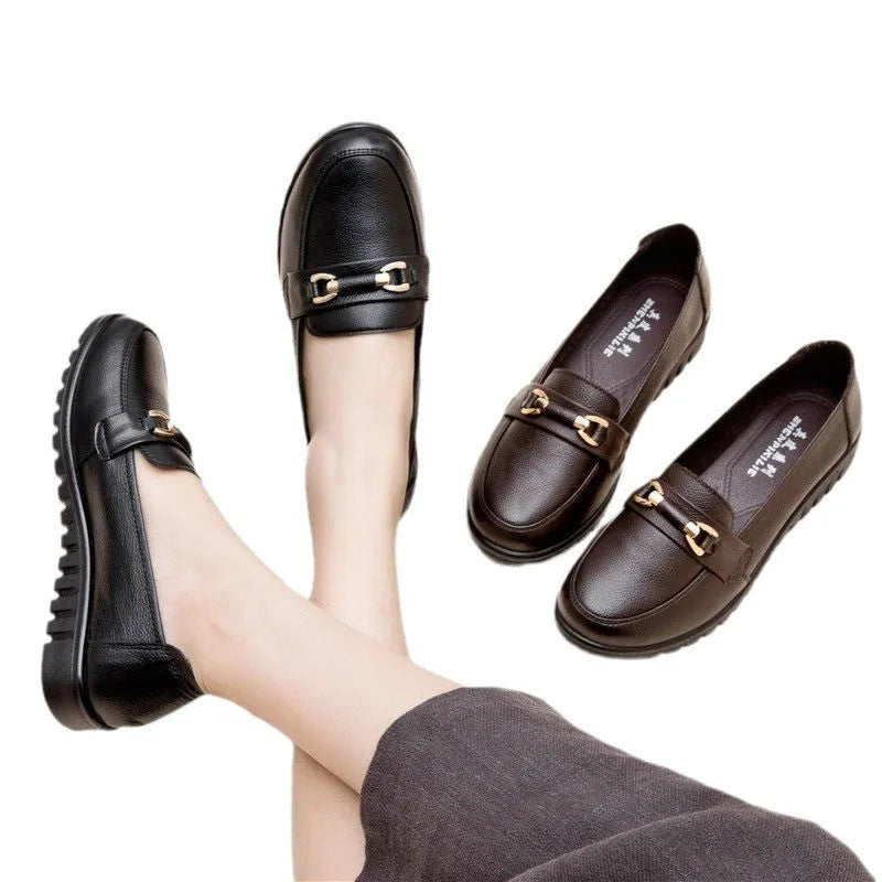 Black soft leather women's pumps with a round toe, low flat heel, and rubber sole.