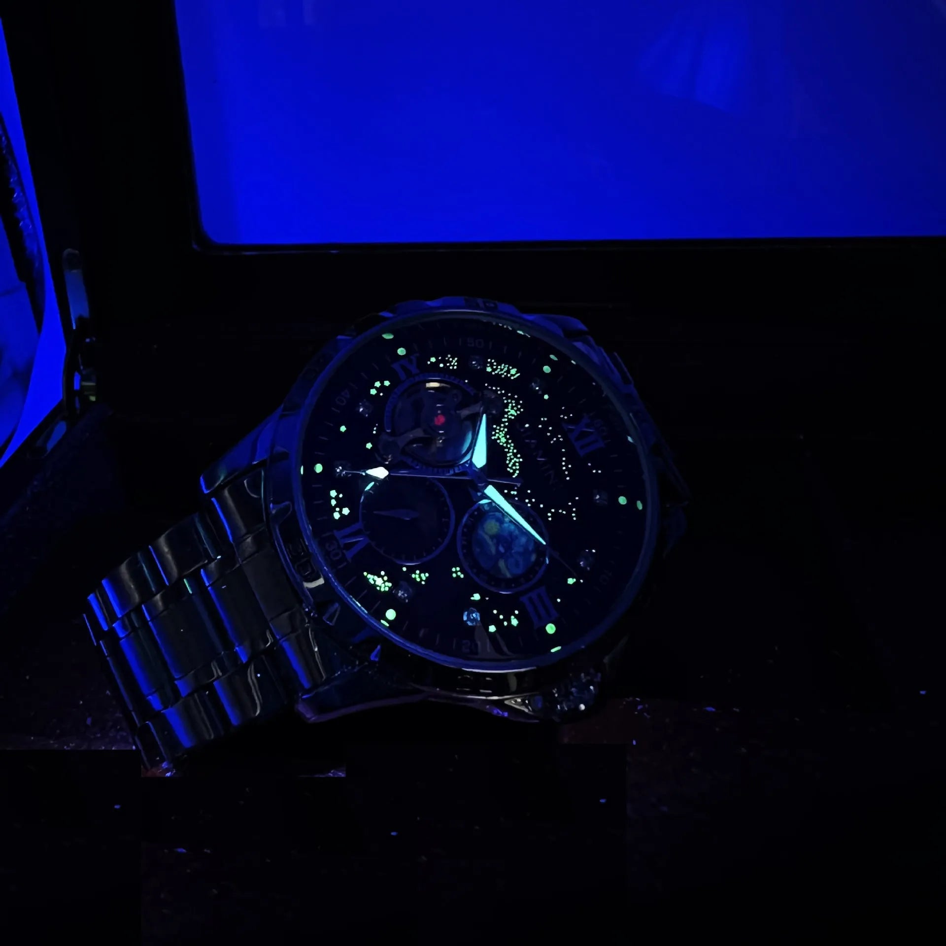 Men's automatic mechanical watch with rose gold casing, black dial, and large display