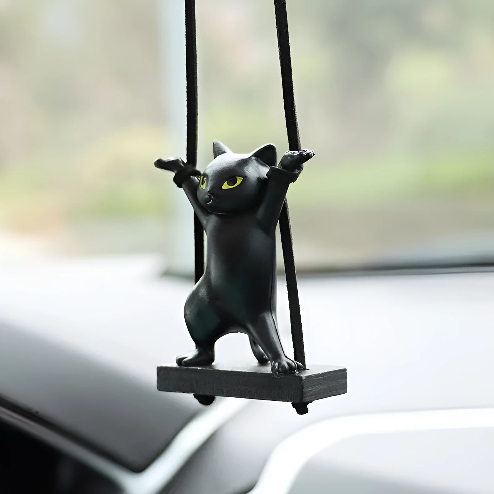 Cartoon-style resin cat pendant car ornament with adjustable rope in colour options including black, white, floral, grey, and brown.