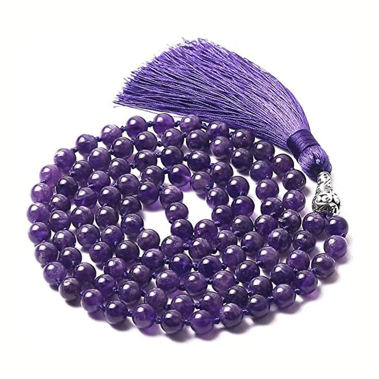 Geometric agate pendant necklace with colourful stone pattern and tassel detail on model