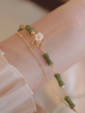 Handmade natural olivine stone bracelet with double layer twin bells of Ireland design.
