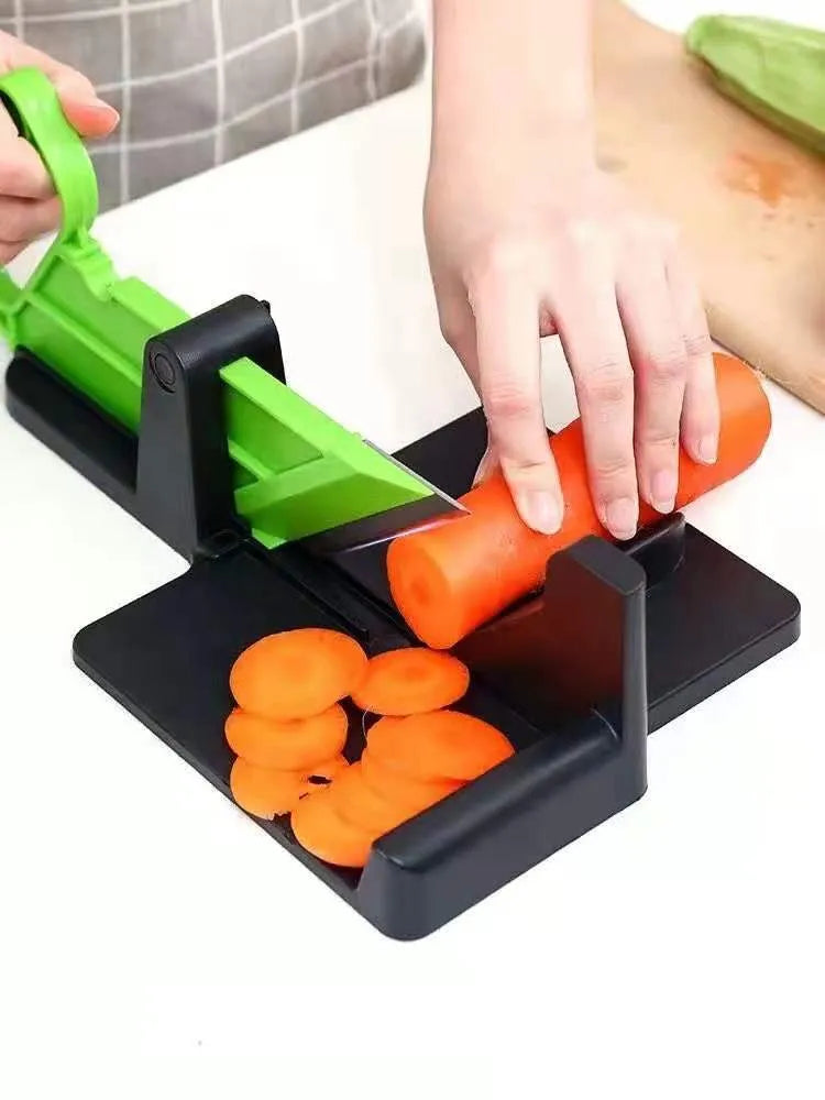 Green and red plastic vegetable cutter with stainless steel blades for slicing carrots and potatoes.