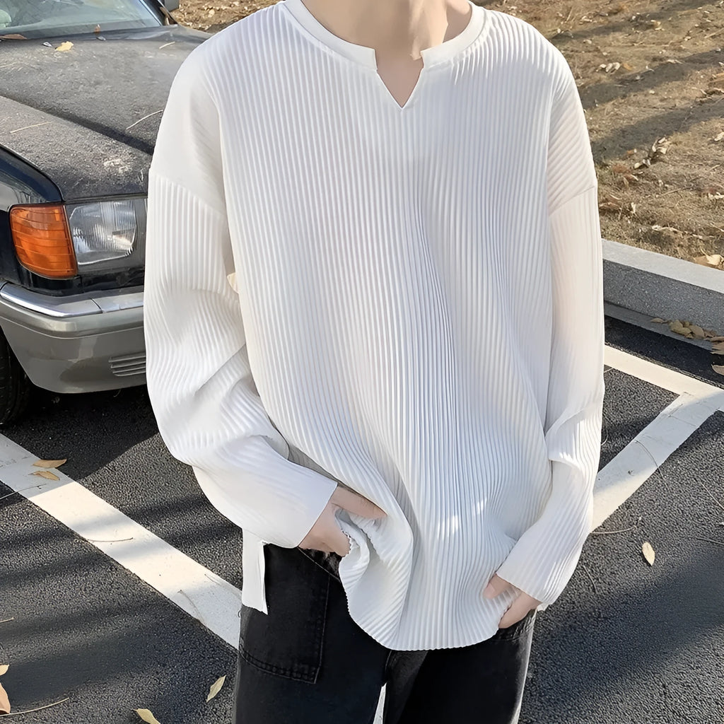 Plus size loose pullover top with striped texture and long sleeves in black colour