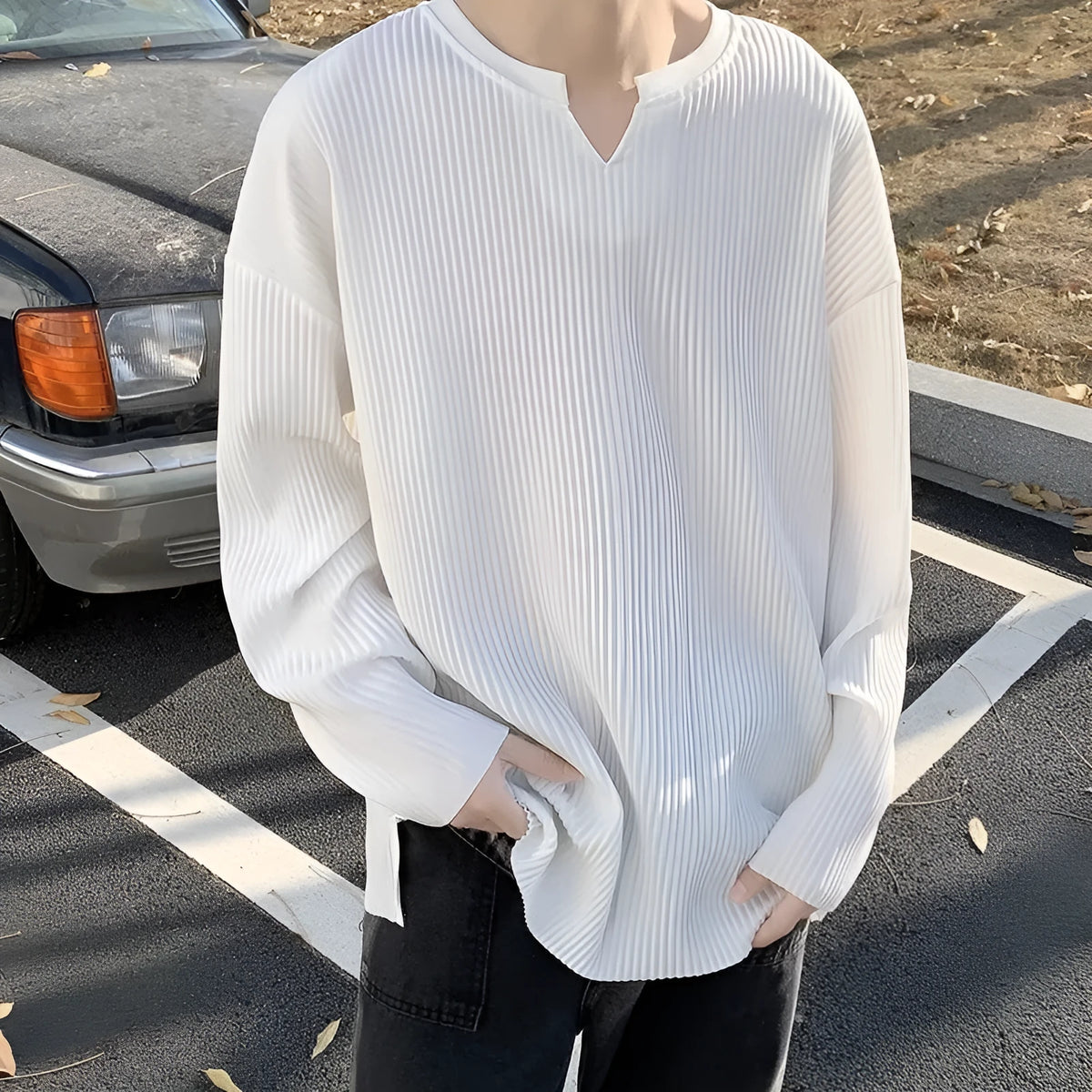 Plus size loose pullover top with striped texture and long sleeves in black colour