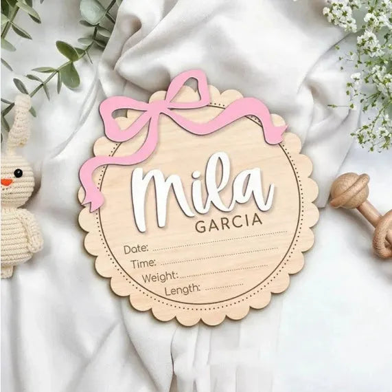 Square wooden baby room ornament with customised name engraving, shown in two size options.
