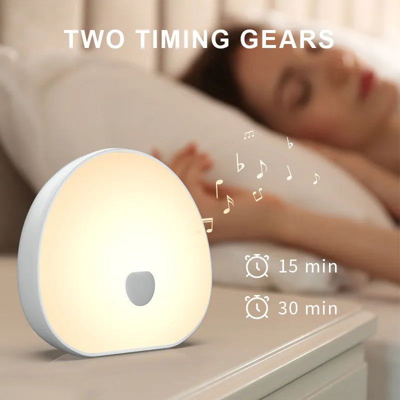 White rechargeable baby feeding comforter with music function for night-time soothing