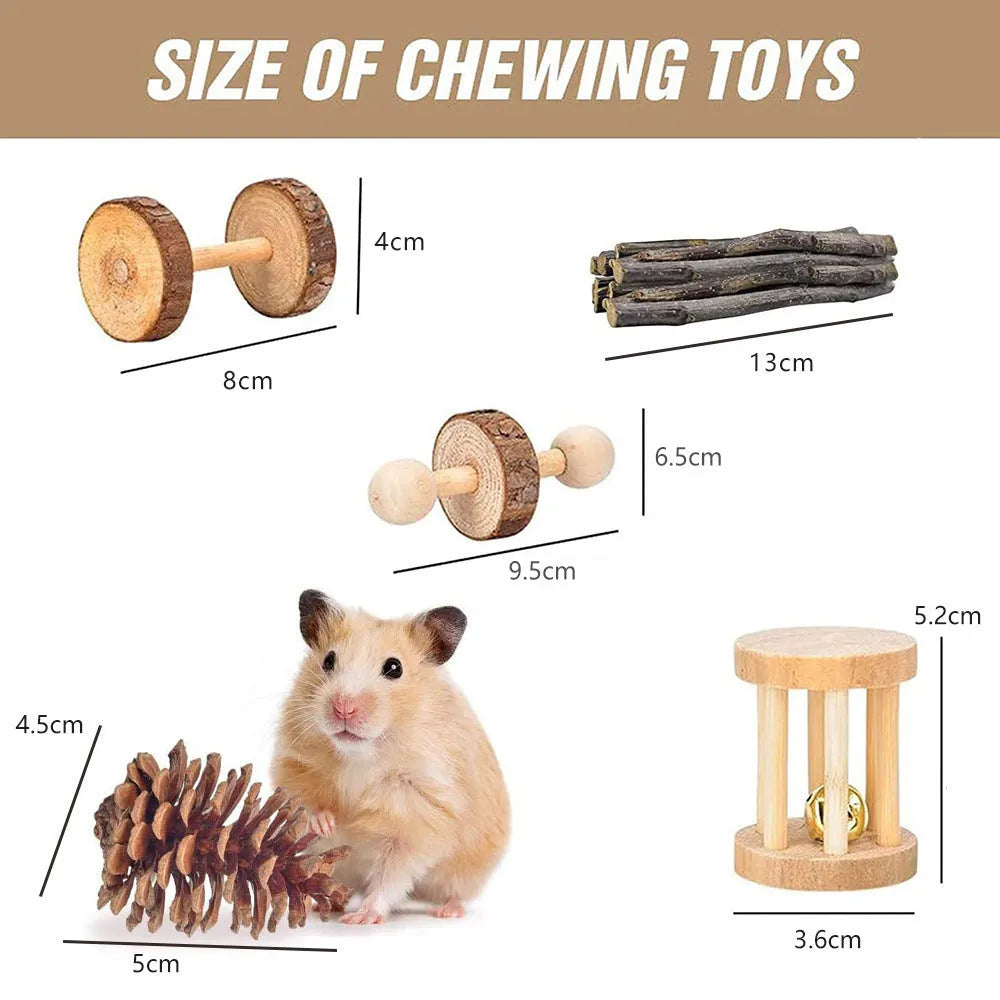 Assorted natural wooden and woven plant chew toys for rabbits, guinea pigs, and parrots on a straw mat.