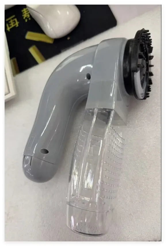 Grey portable pet hair vacuum cleaner with soft rubber head and large collection canister