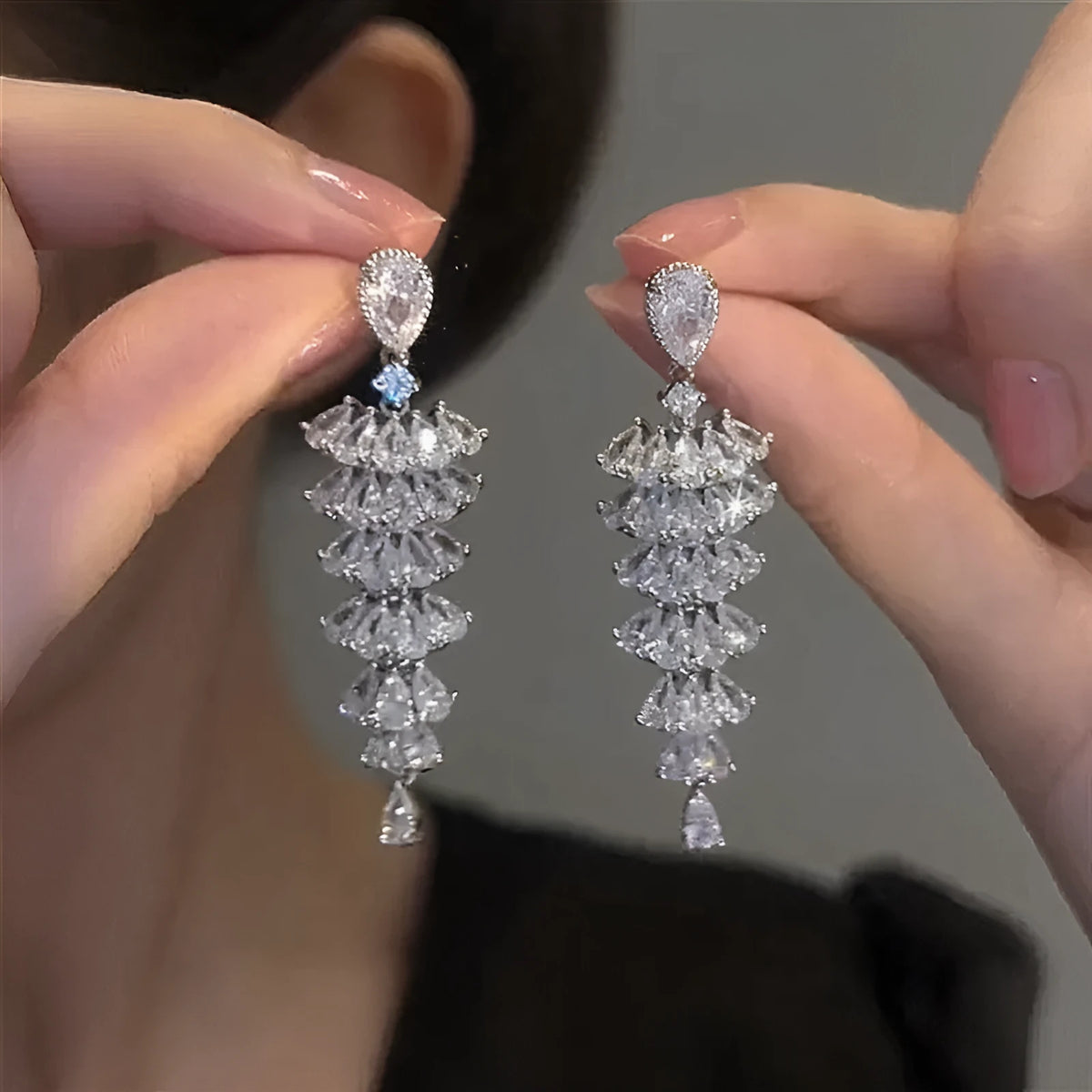 Silver pagoda coloured drop earrings with a sparkling zircon Christmas tree design on copper studs.