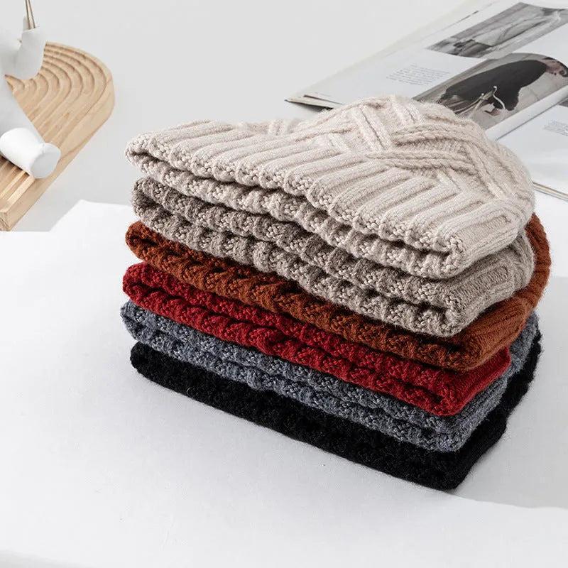 Wool knitted dome crown beanie in six colour options with totem pattern detail