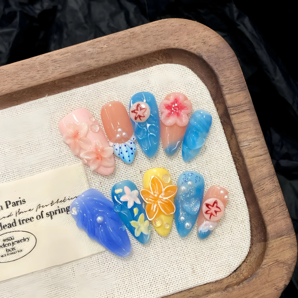 Three-dimensional carved jellyfish design wearable armour in almond nail colour with rose and tulip patterns