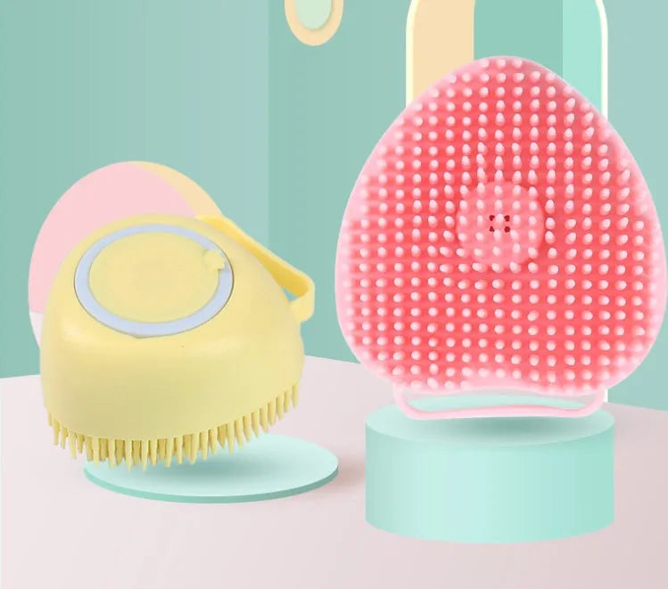 Silicone dog bath brush with ergonomic handle in blue, pink, or yellow colour
