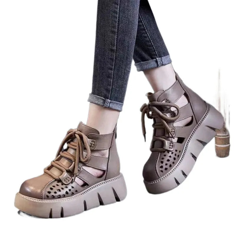 Women's black platform sandals with hollow hole design and fish-mouth toe, made from soft cowhide leather.