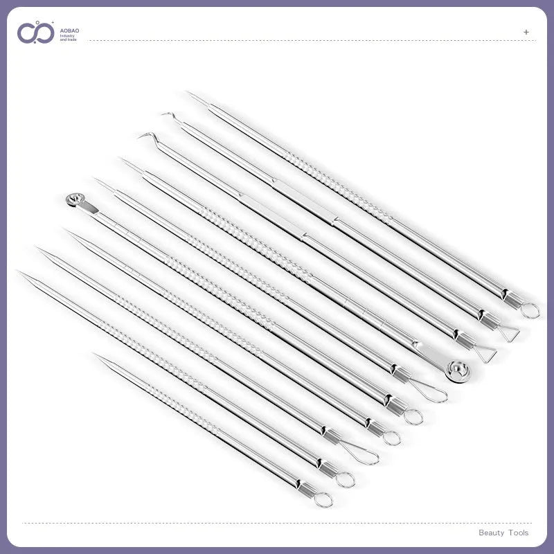 Four silver metal acne needles with fine points held together by a metal clip.