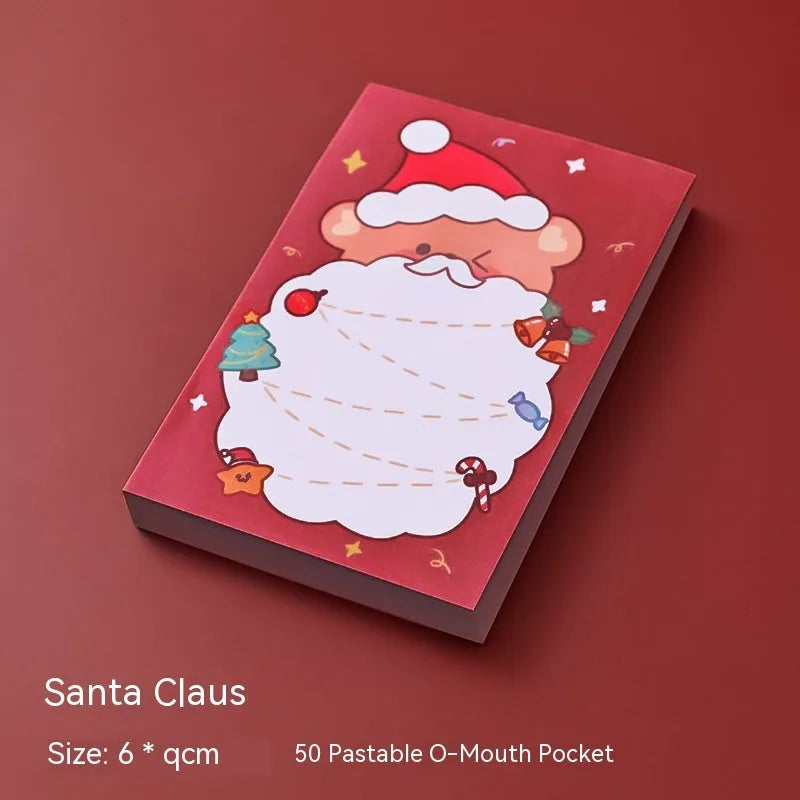 Christmas sticky notes book with cartoon designs of Santa, snowman, elf, gift, house, sled, crystal ball, and bear