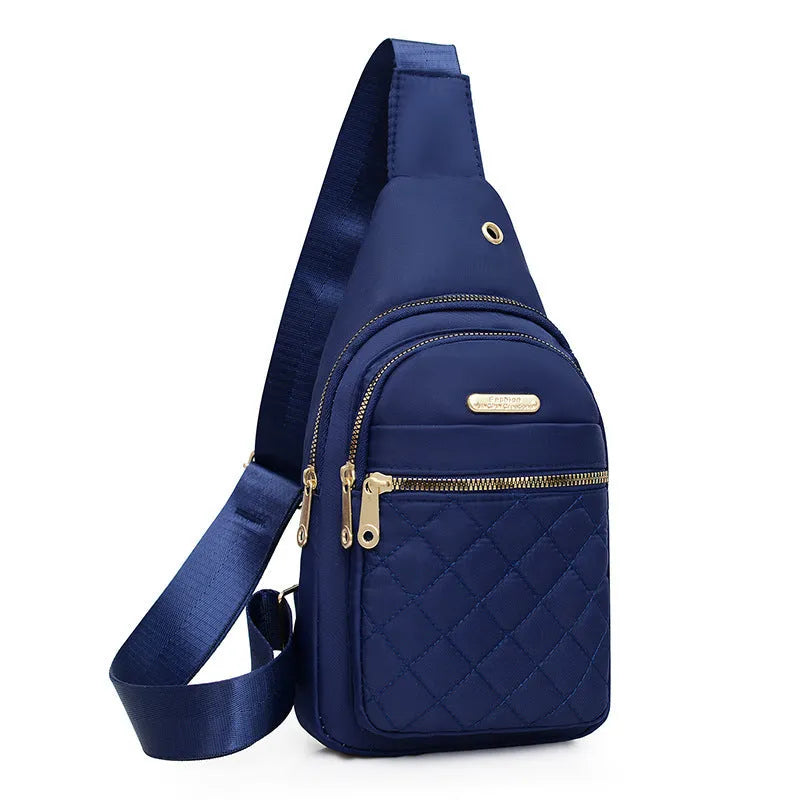 A girl's crossbody sports chest bag in Oxford cloth, shown in a choice of colours including black, dark blue, red, purple, and pink.