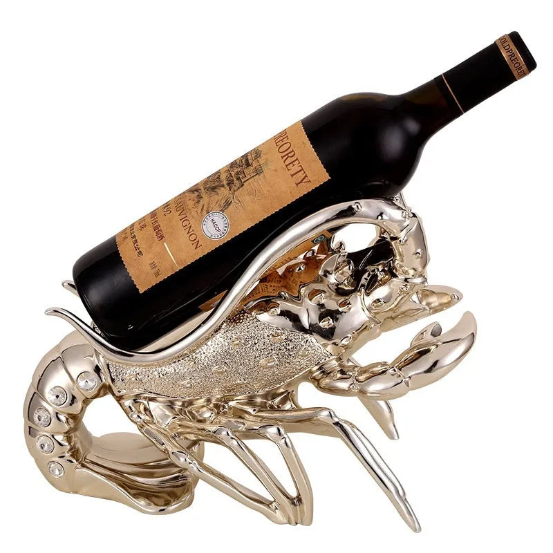 Lobster-shaped wine rack ornament in metallic rose gold or silver finish on display surface