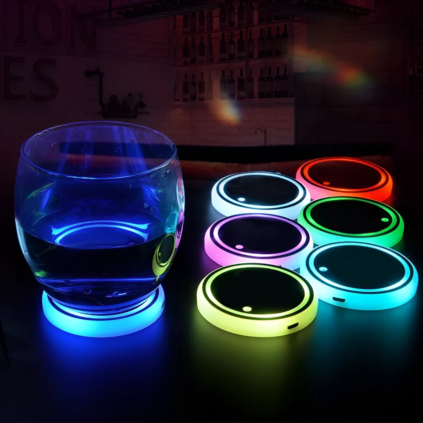 Colourful LED light-up coaster for car cup holders showing seven colour options and USB charging cable