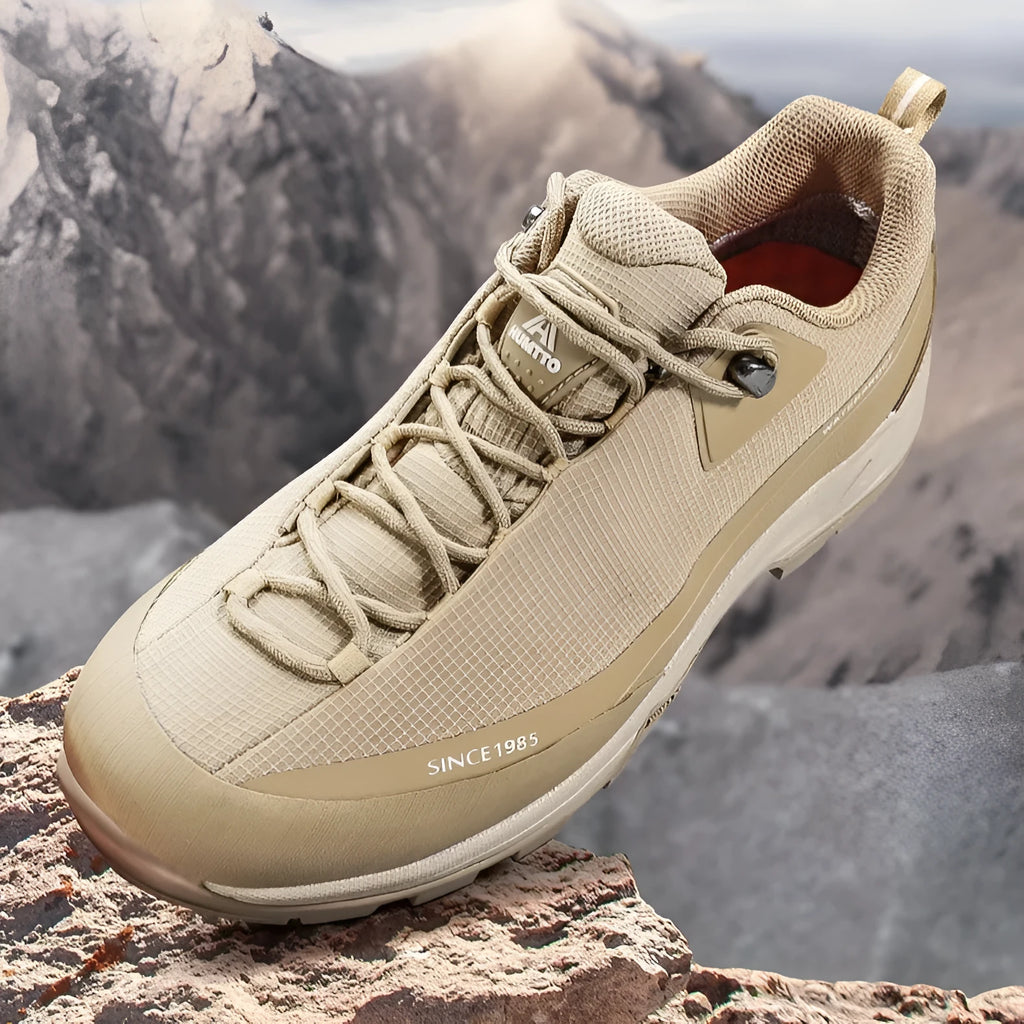 Men's low-top leather mesh hiking boots in black with non-slip rubber sole and lace-up front.
