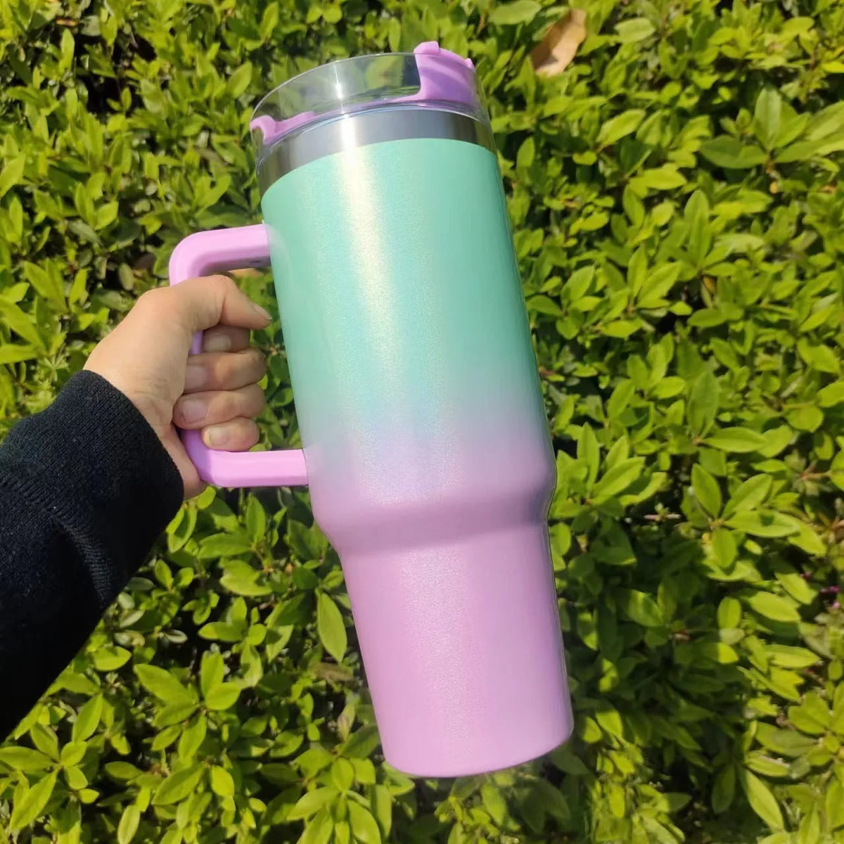 Large stainless steel vacuum insulation cup with gradient colours showing thermal insulation design