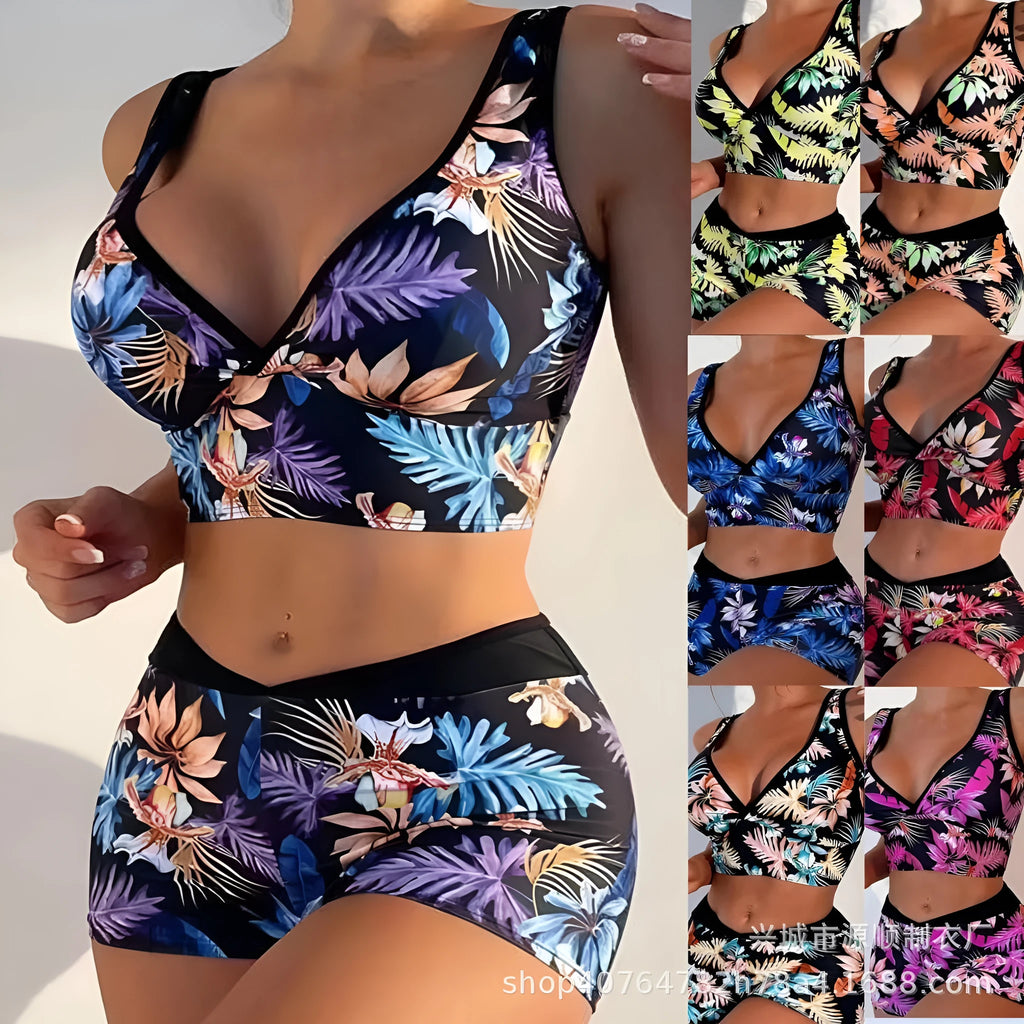 Women's two-piece printed boxer swimsuit set in a colourful style, showing sleeveless top and briefs.