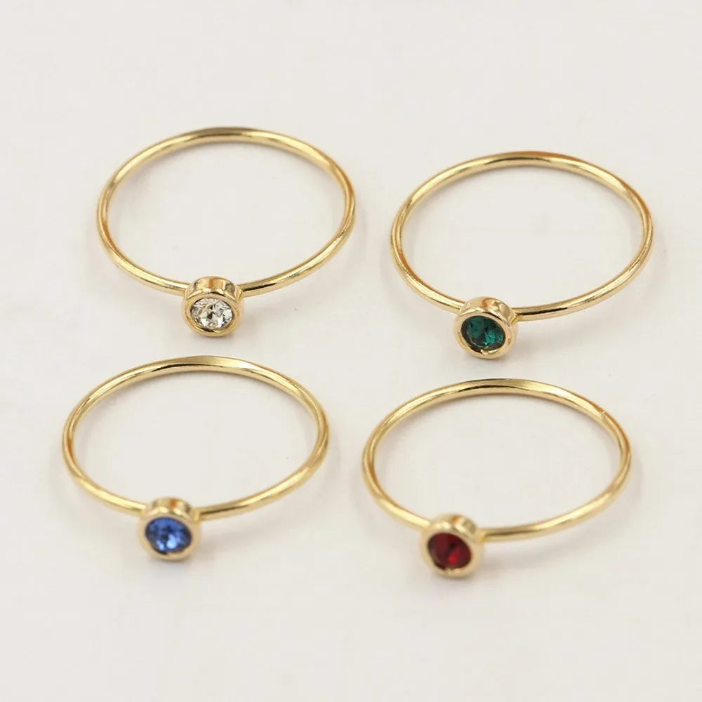 Women's copper knuckle ring with 14K gilded finish and colourful GF zircon stones.