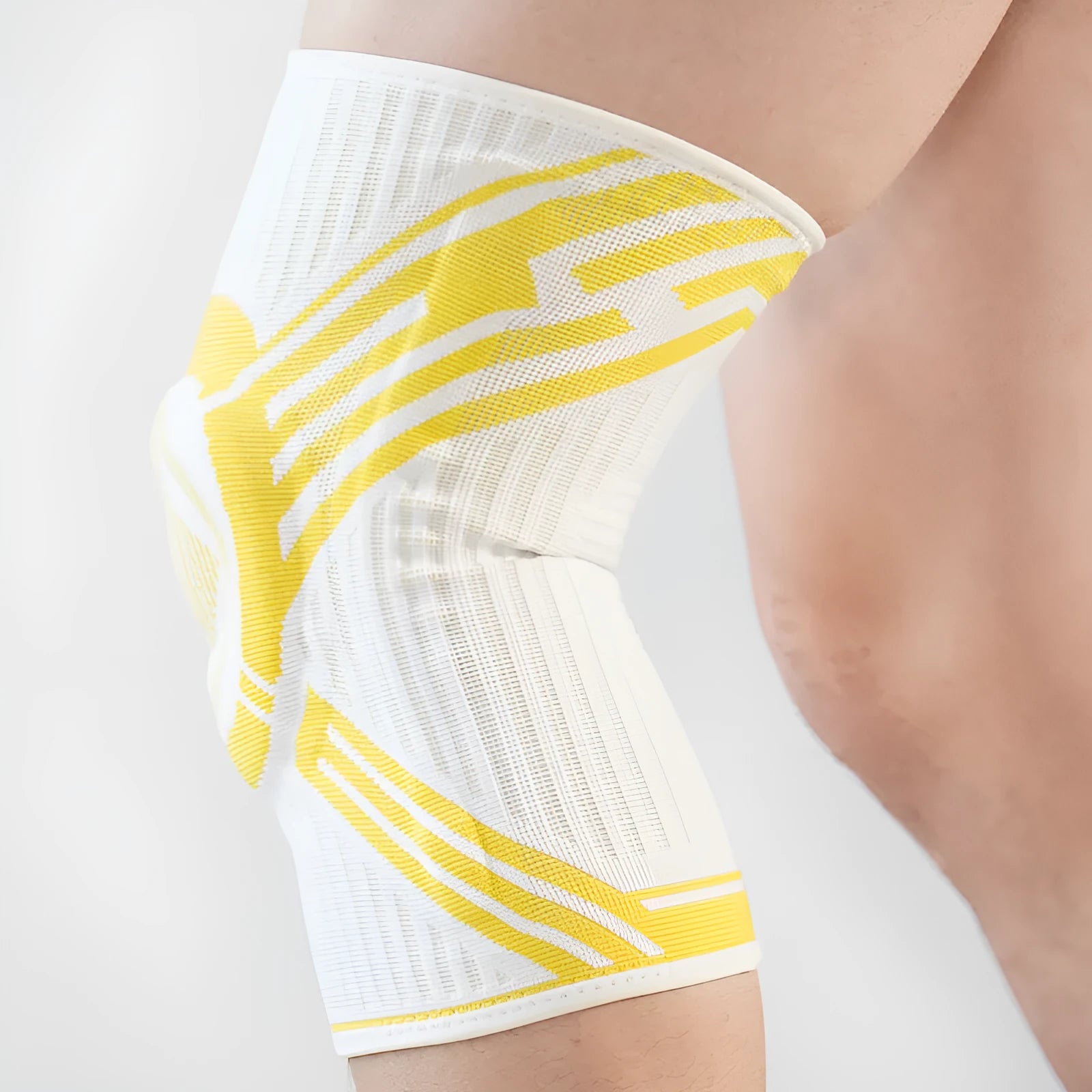 Blue high elasticity cotton knee pad for sports on an adult knee.