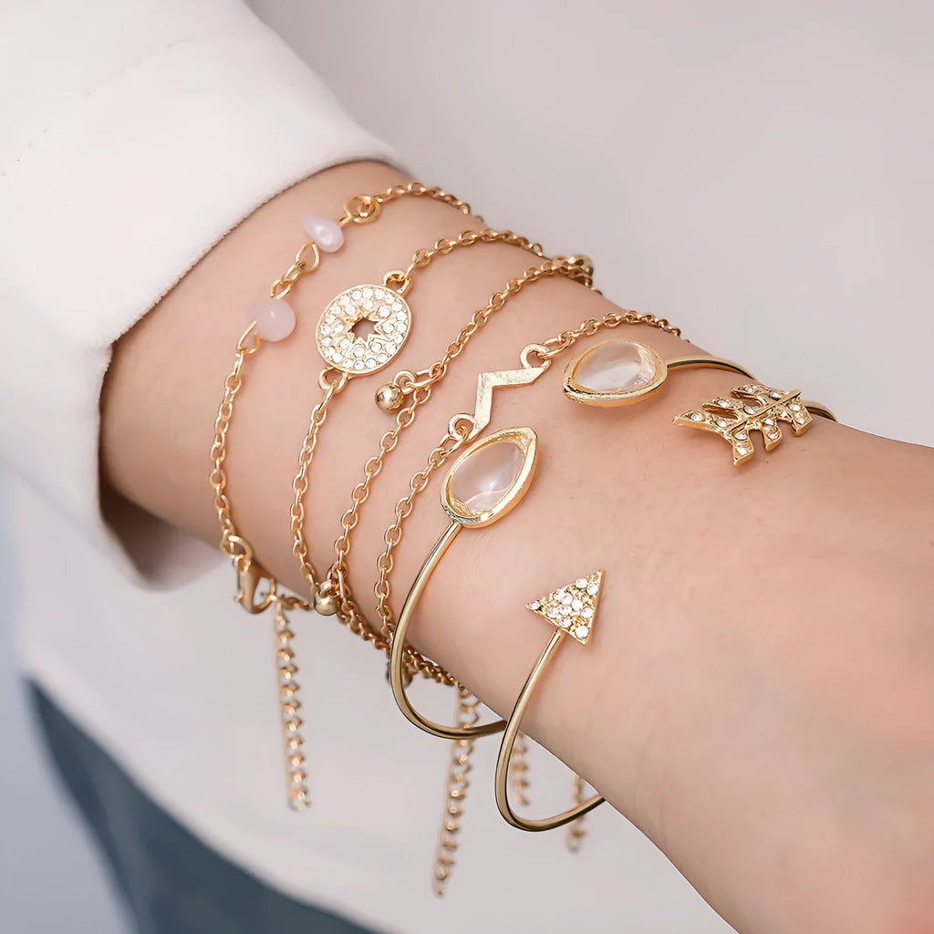 Set of six gold-coloured women's bracelets with arrow, water drop, and V-shaped pendants.