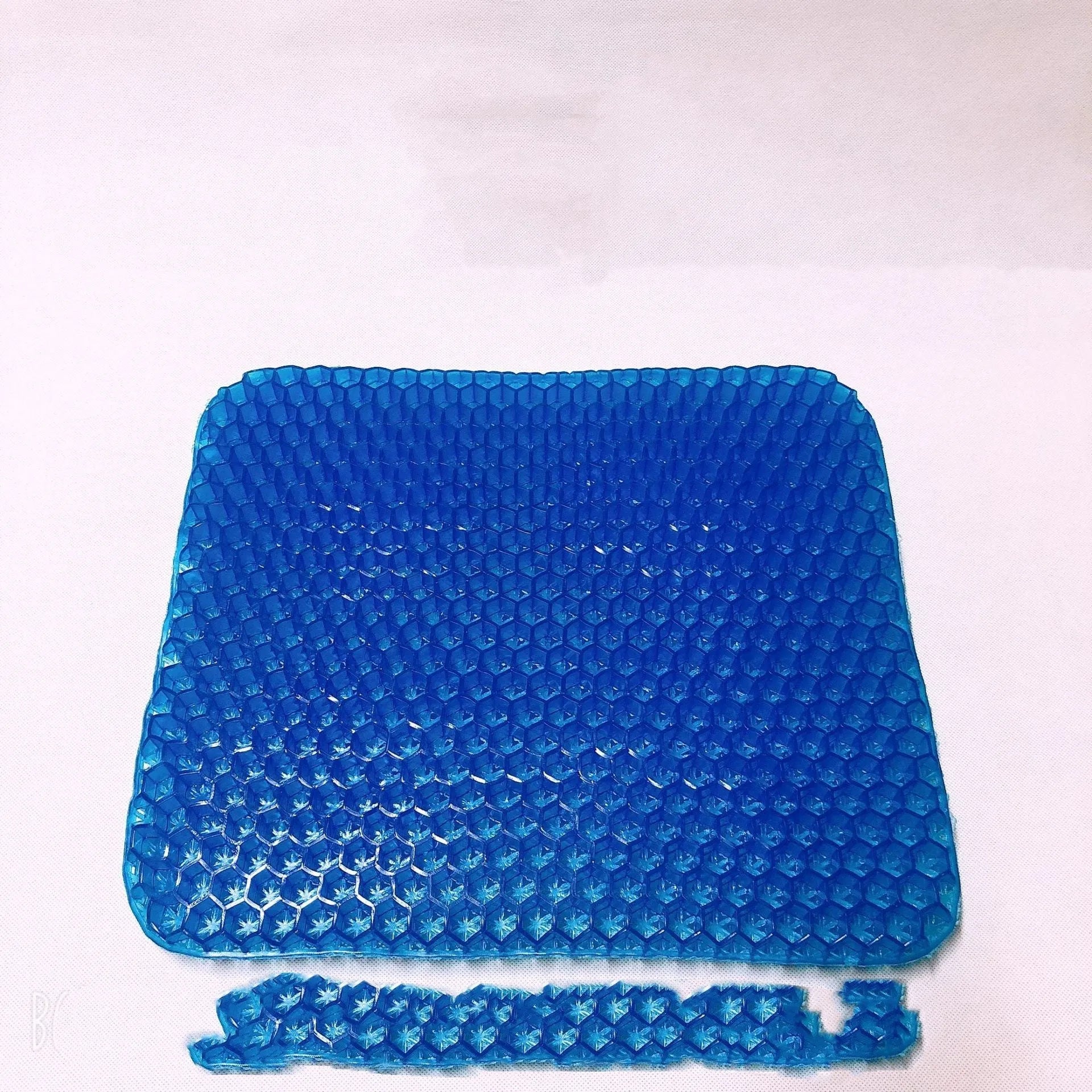 Gel seat cushion with honeycomb pattern showing double thick construction for pressure relief