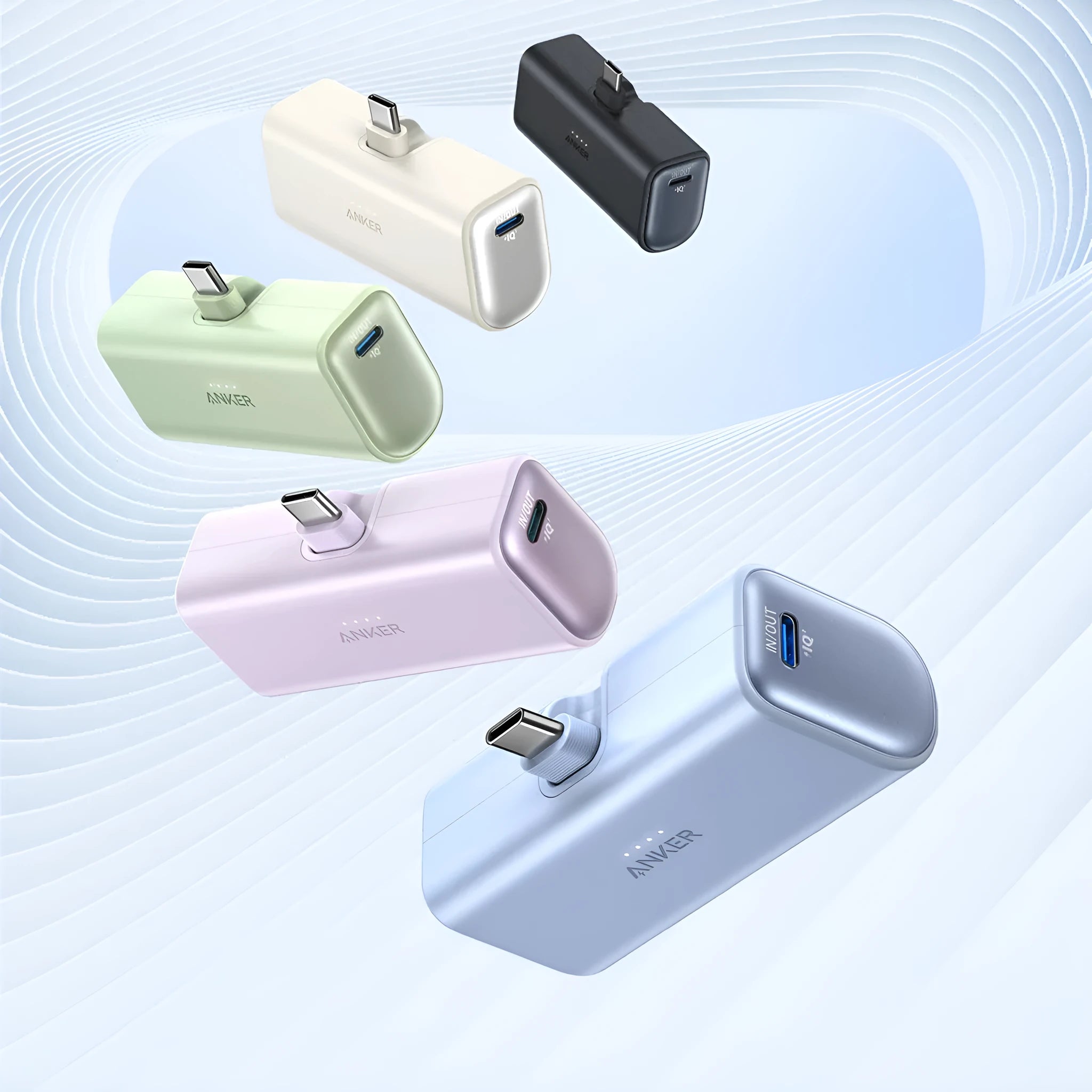 Compact capsule-shaped plastic power bank in five colours showing foldable charging head and Type-C port