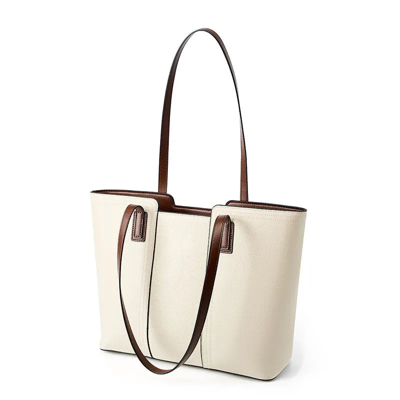 Women's black genuine leather horizontal square shoulder bag with crossbody strap showing internal organiser compartments.