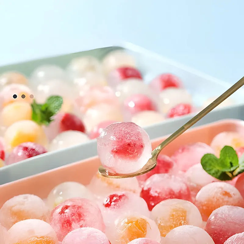 Blue round silicone ice cube tray with 33 grids and a clear lid, shown next to pink version