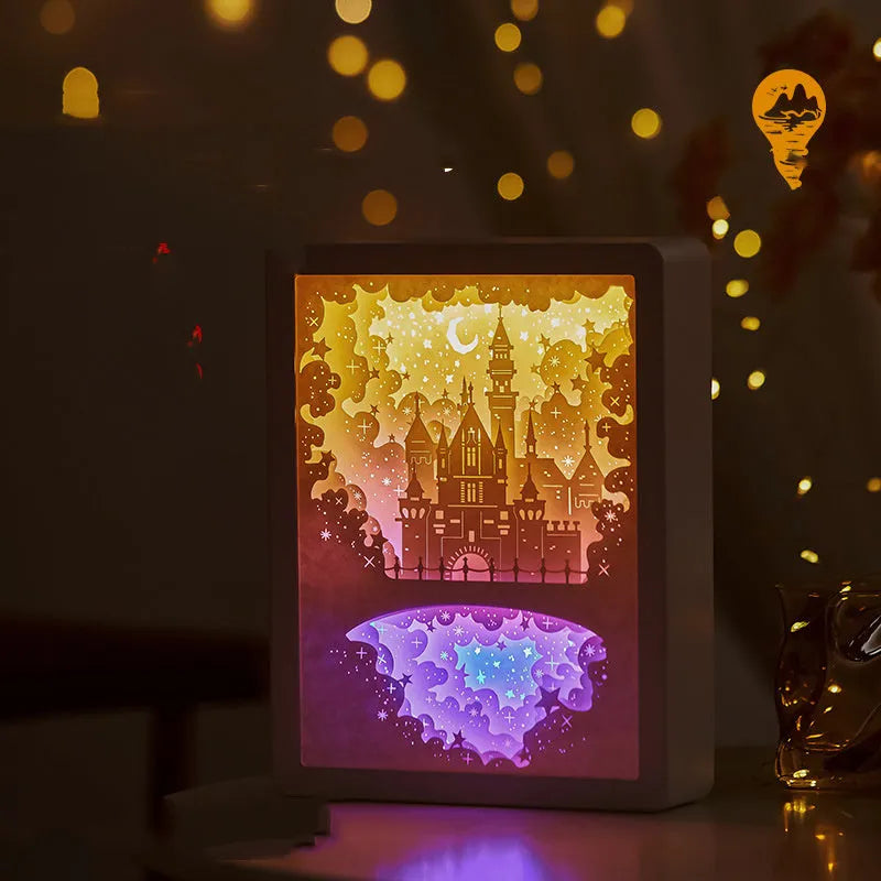 Modern bedside night light with 3D paper carving design on white plastic shade, showing yellow ambient glow.