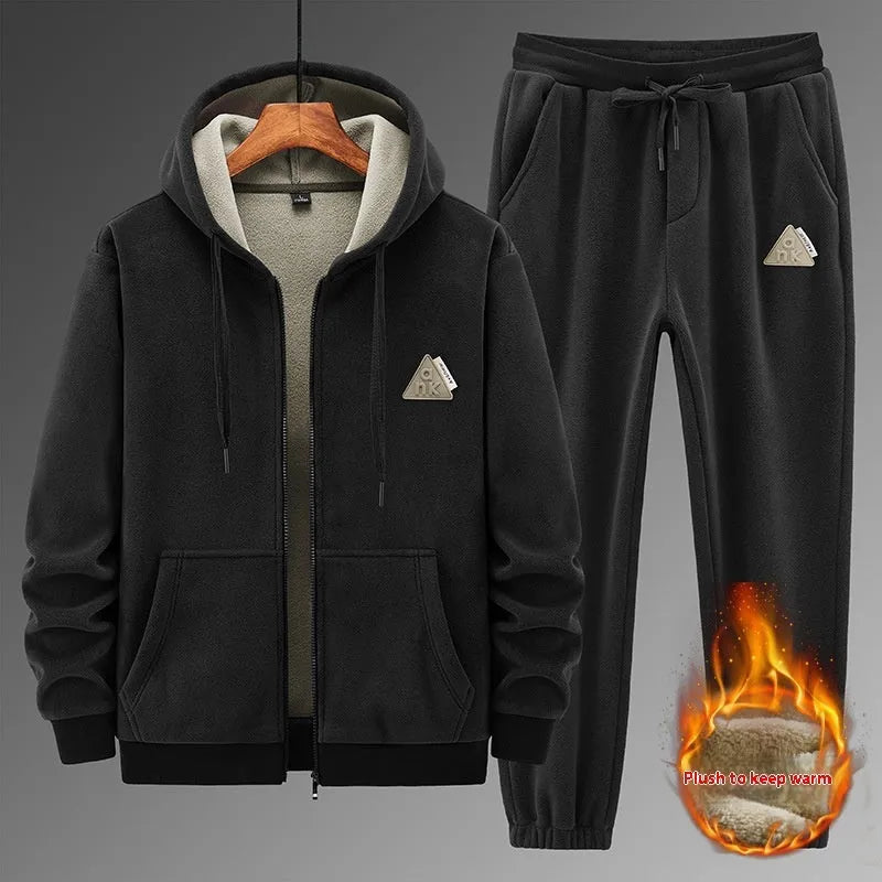 Grey men's hooded sweater and matching trousers casual sports suit set on a hanger.