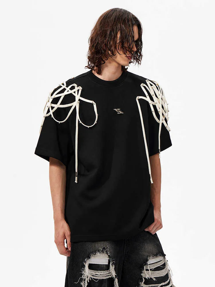 Black short-sleeved T-shirt with padded shoulders and rivet ribbon detail in loose fit style