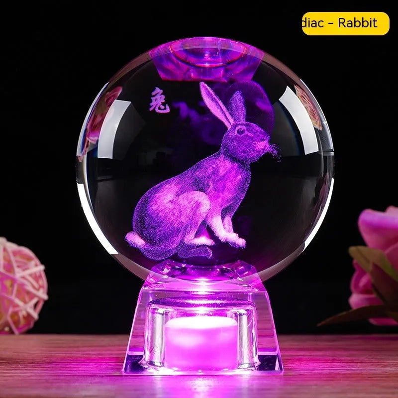 White crystal zodiac ornament with electronic luminous base showing Chinese animal design