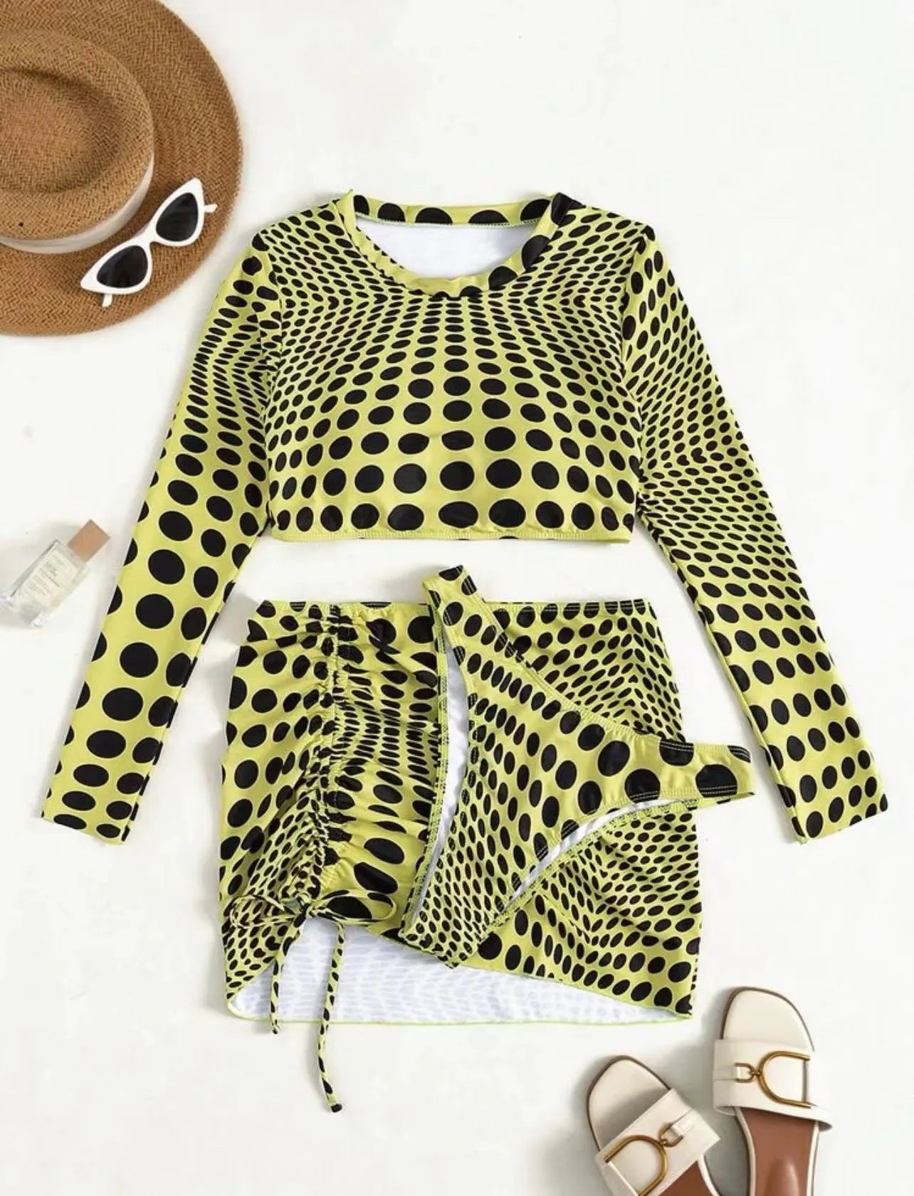 Women's green and yellow polka dot three-piece swimsuit set with top, skirt, and bra.