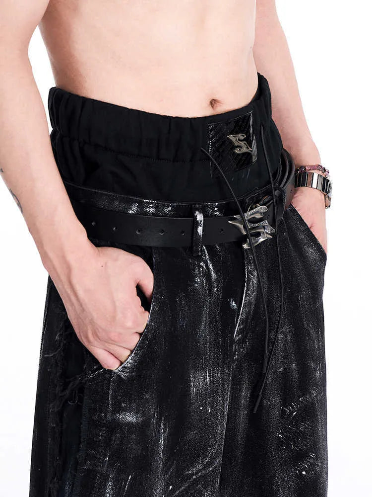 Black men's leather belt with metal letter buckle showing two-layer cowhide construction