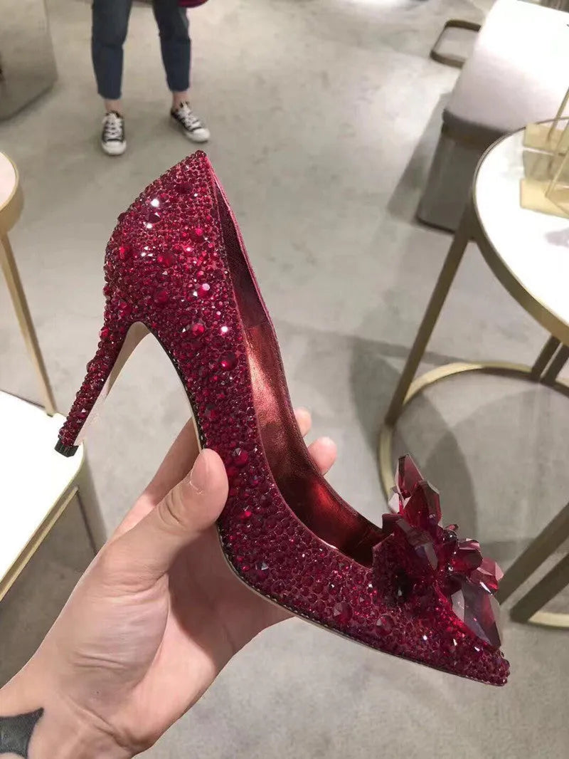 Gold and silver women's stiletto high heels with sequined pointed toes and rhinestone decoration.