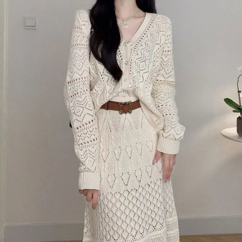 Beige hollow-out knitted two-piece skirt set with long sleeve top, mid-length skirt and belt