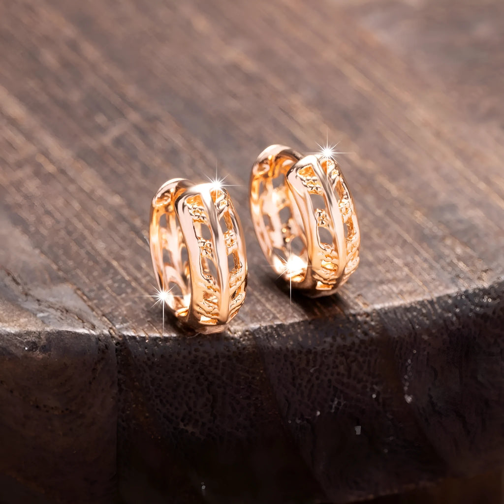 Rose gold hollowed leaf and heart shaped copper earrings on display
