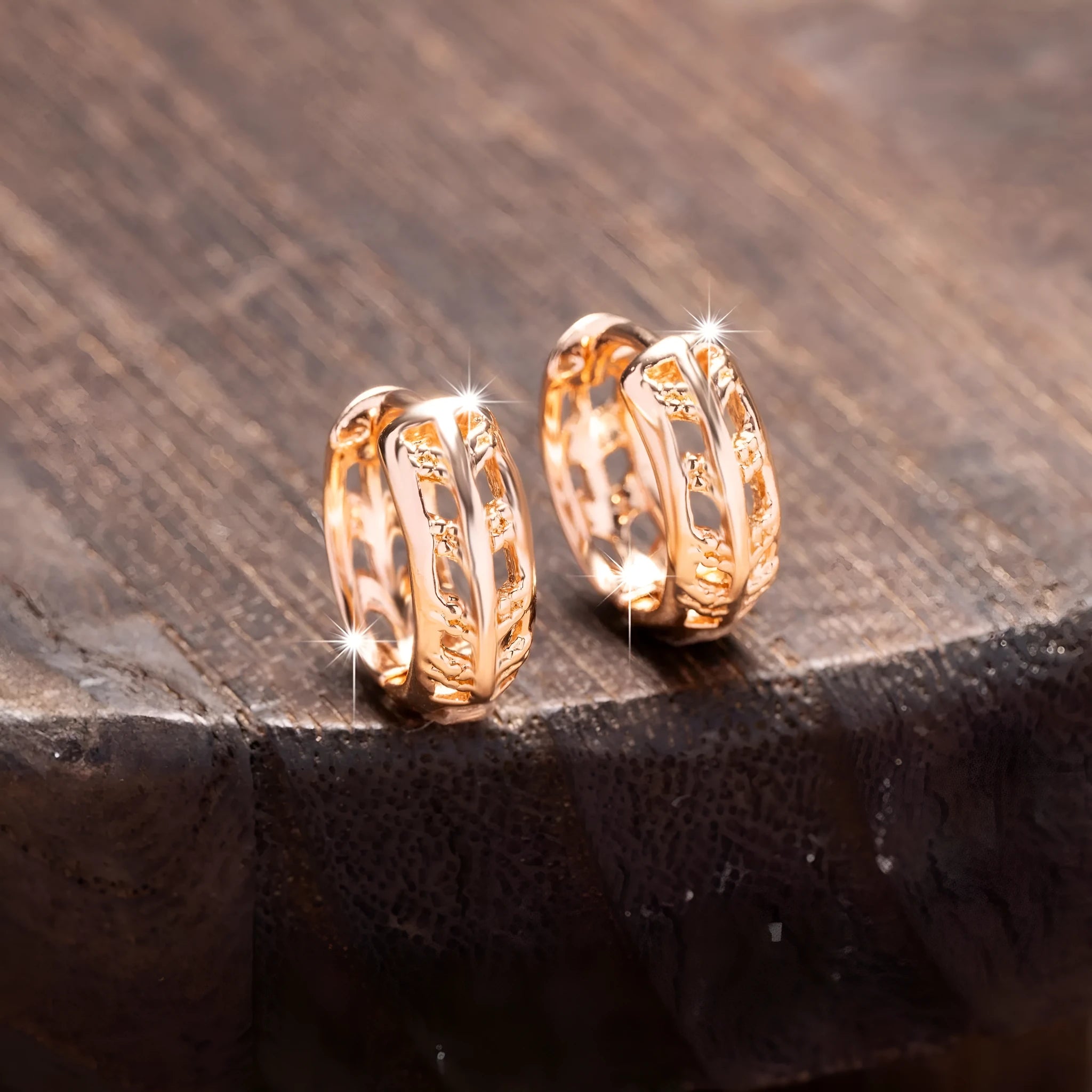 Rose gold hollowed leaf and heart shaped copper earrings on display