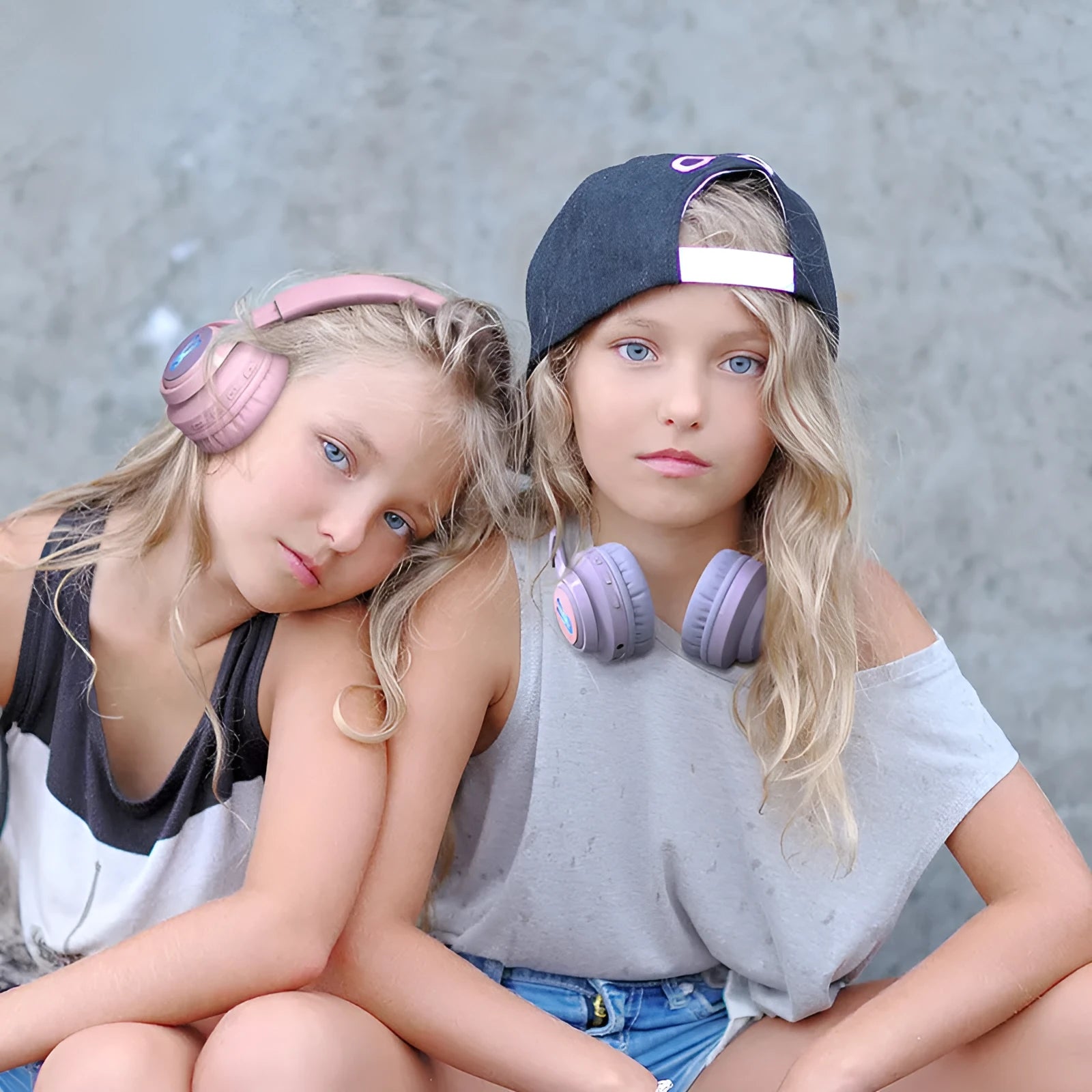 Children's wireless headphones with RGB lights in bunny pink colour showing power display and microphone